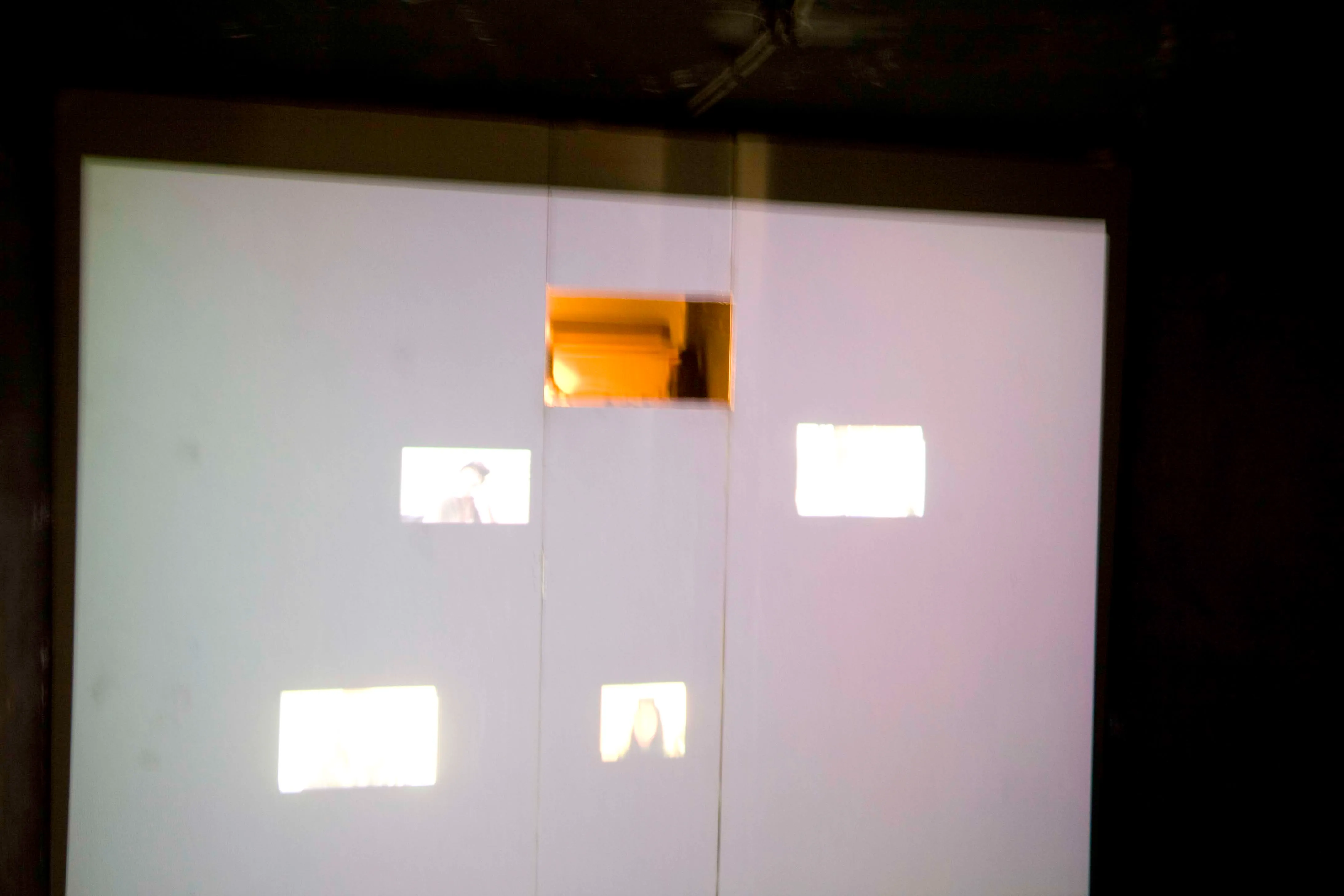 Internércia — the projection wall by day